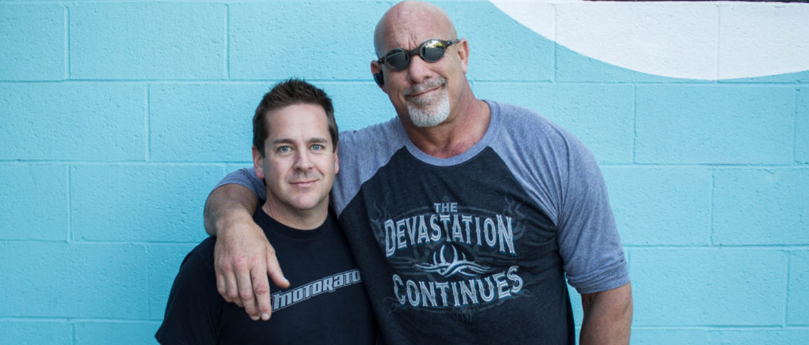 Bill Goldberg standing next to Matt D'Andria with his arm around Matt