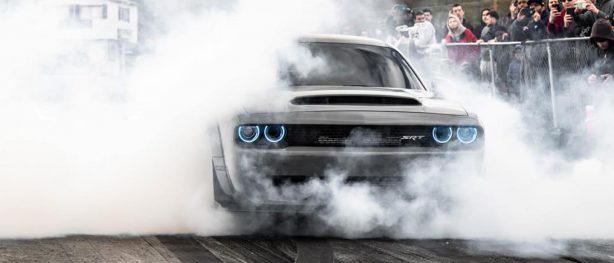 Gray Dodge Demon doing a burnout