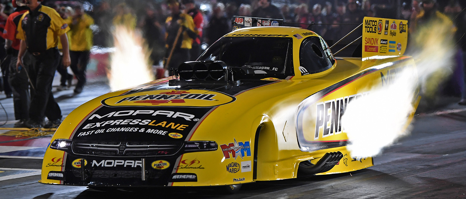 Matt Hagan racing down the track in his Dodge Charger SRT Hellcat Funny Car