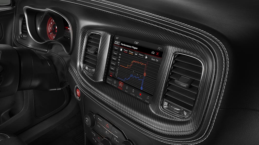 Standard SRT Performance Pages in the 2020 Dodge Charger SRT Hellcat Widebody bring critical vehicle performance data to the driver’s fingertips, including real-time engine data such as horsepower, torque, oil pressure and dyno graph. Included in the available Carbon & Suede Package are real carbon fiber instrument panel and console bezels.
