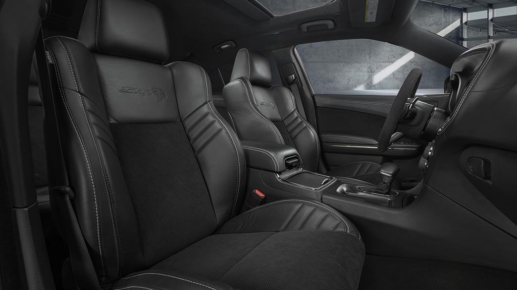 The race-inspired interior of the Dodge Charger SRT Hellcat Widebody features standard heated and ventilated Laguna leather front seats with embossed Hellcat logo - available interior color combinations include Black, Black/Sepia or Black/Demonic Red