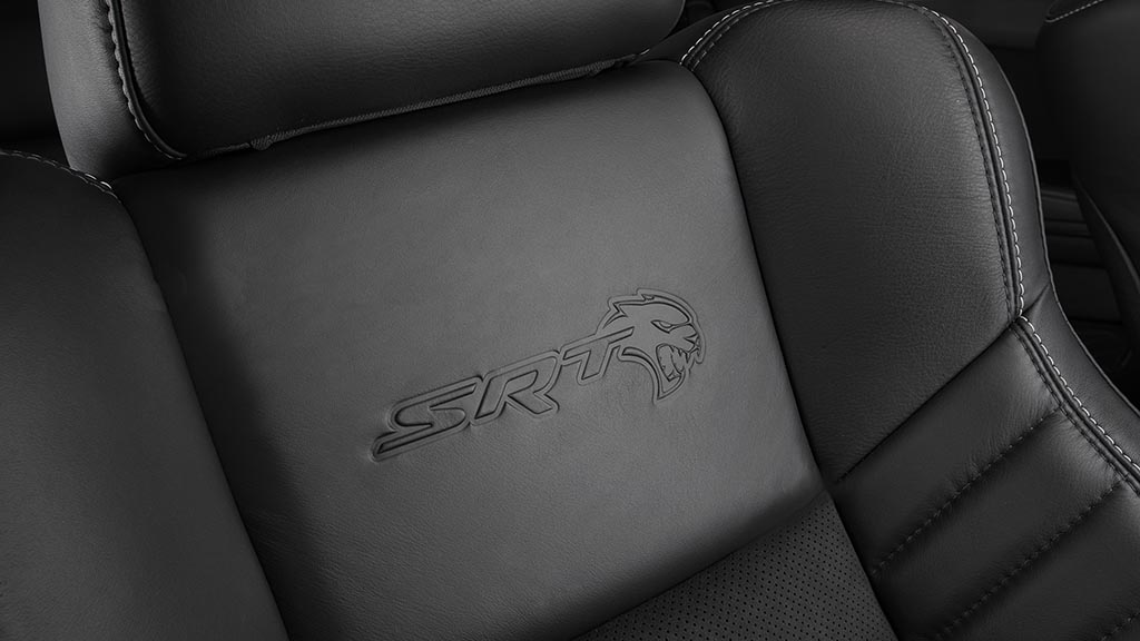 Standard heated and ventilated Laguna leather front seats feature embossed Hellcat logo in the 2020 Dodge Charger SRT Hellcat Widebody