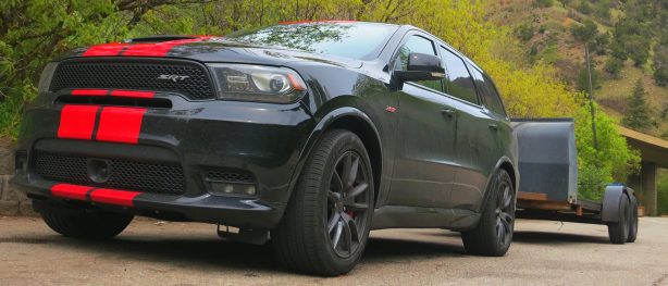 Dodge Durango SRT front right view low to the ground pulling a trailer.