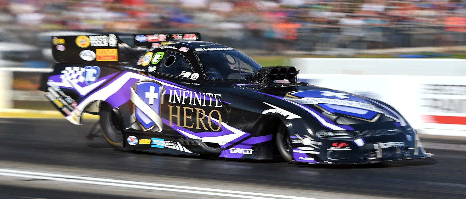 Jack Beckman racing his Infinite Hero Dodge Charger SRT Hellcat Funny Car at NHRA Heartland Nationals