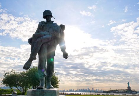 a statue of one soldier carrying another