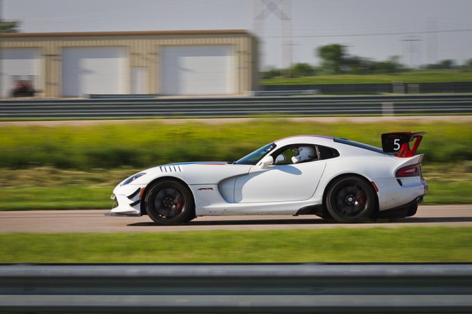 one dodge viper driving around a race track