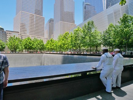 two soldiers looking at the nine eleven memorial