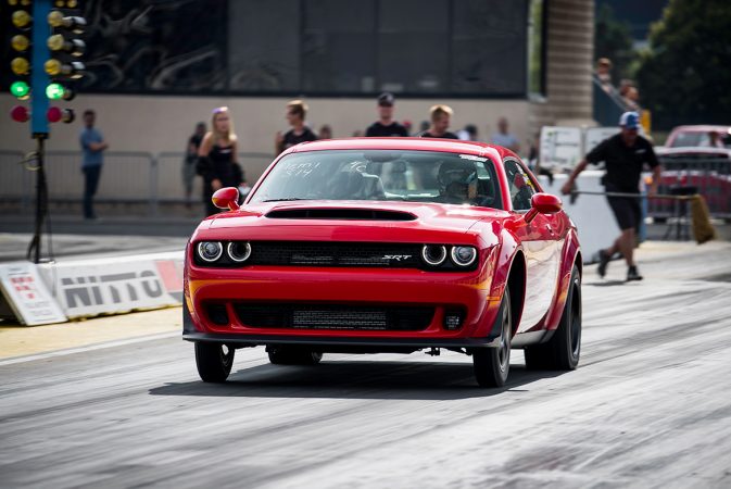 dodge vehicle on the starting line of a drag strip 