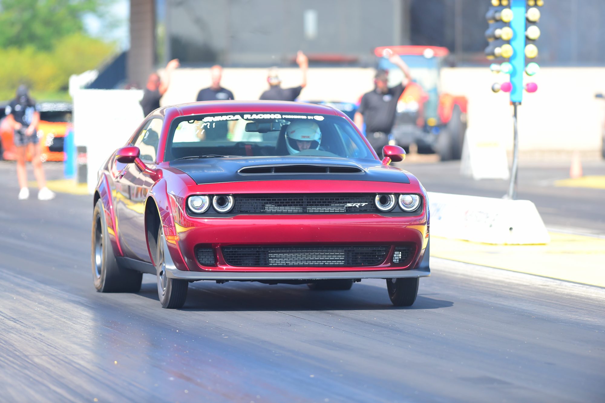 dodge vehicle on the starting line of a drag strip 