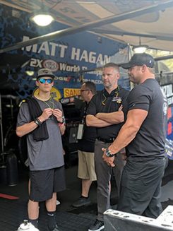 matt hagan with two men in his pit