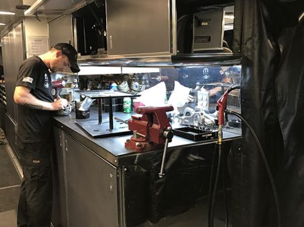 tools and vehicle parts inside matt hagan's trailer