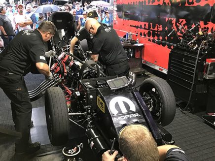 crew team working on matt hagan's funny car