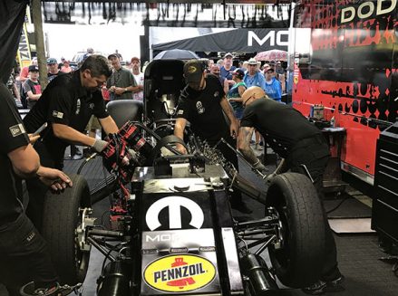 crew team working on matt hagan's funny car