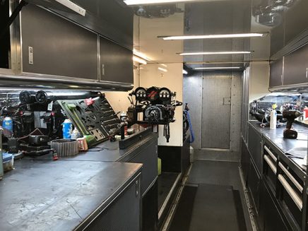 tools and vehicle parts inside matt hagan's trailer