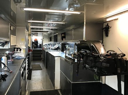 tools and vehicle parts inside matt hagan's trailer