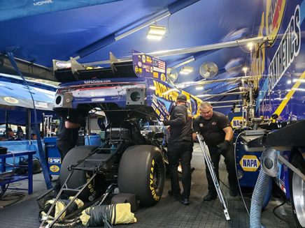 crew working on ron capps' funny car