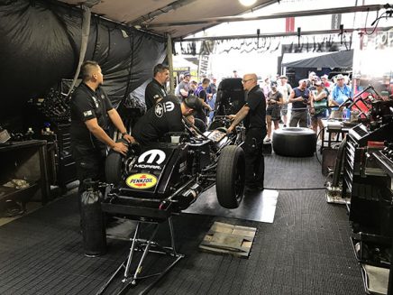 crew team working on matt hagan's funny car