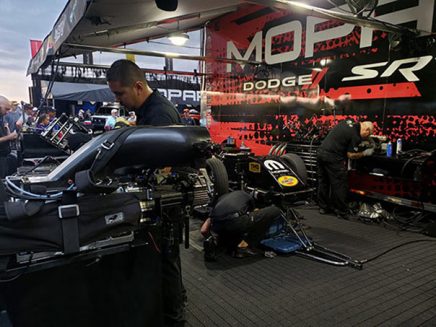 crew team working on matt hagan's funny car