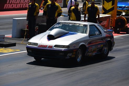 gray vehicle on the starting line of a drag strip