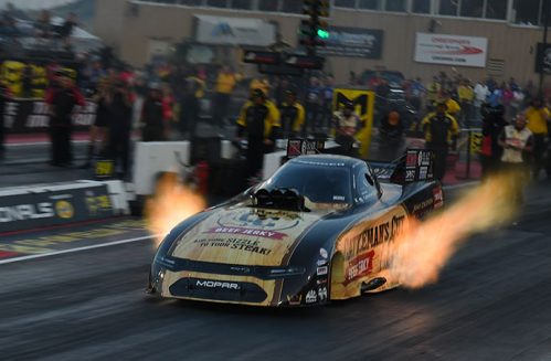 funny car racing down the drag strip