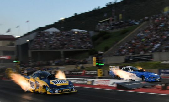 funny car racing down the drag strip