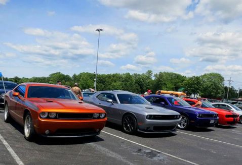 several vehicles all parked in a line