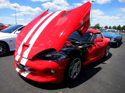 a red vehicle with the front hood open