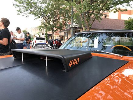 orange vehicle with shaker hood