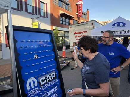 enthusiasts playing a mopar branded plinko game