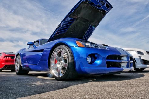 a blue vehicle with it's front hood open