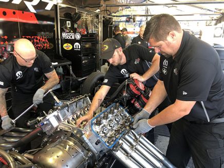 crew team working on matt hagan's funny car