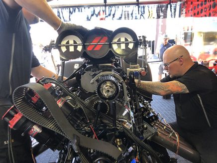 crew team working on matt hagan's funny car