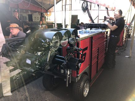 crew members working on cruz pedregon's funny car