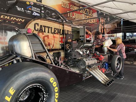 crew working on jim campbell's funny car