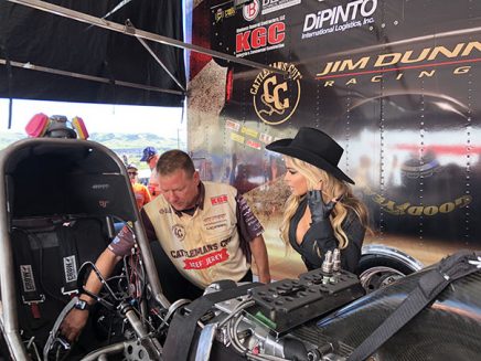 carmen electra being shown jim campbell's funny car