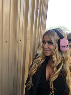 carmen electra wearing racing headphones