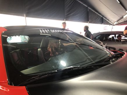 carmen electra in a dodge srt demon simulator