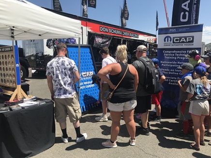 people playing a mopar branded plinko game