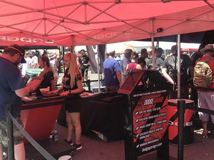 people signing up at a booth