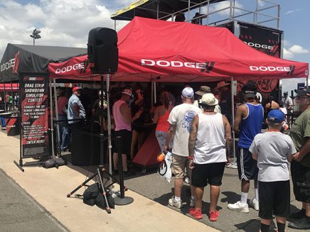 people lined up outside a tent