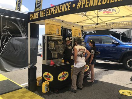 people standing at a booth