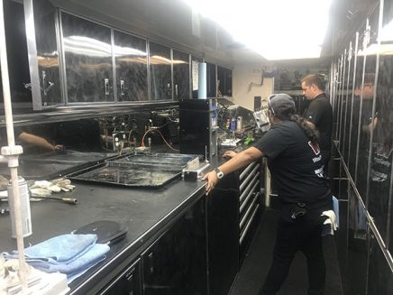 crew working inside tommy johnson jr's trailer