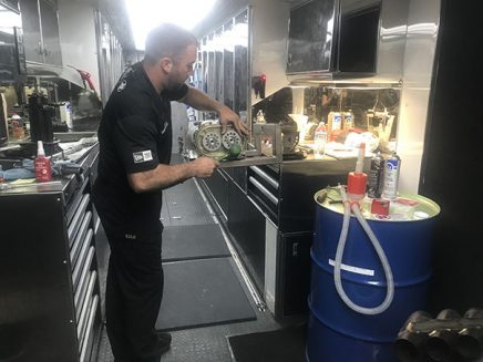 crew working inside tommy johnson jr's trailer