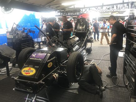 crew working on jack beckman's funny car