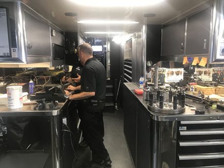 crew working inside jack beckman's trailer