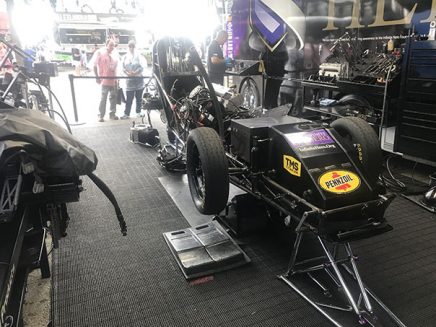 crew working on jack beckman's funny car