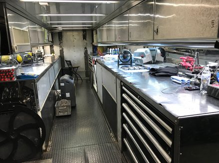 tools and vehicle parts inside ron capps' trailer