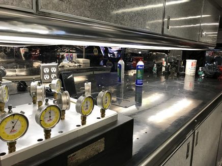 tools and vehicle parts inside ron capps' trailer
