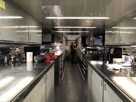 tools and vehicle parts inside ron capps' trailer