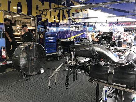 crew working on ron capps' funny car